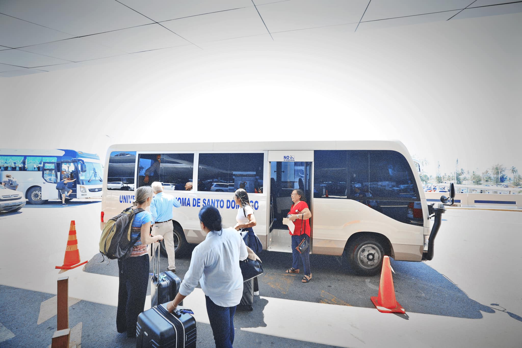 Image of our group getting into the UASD bus.