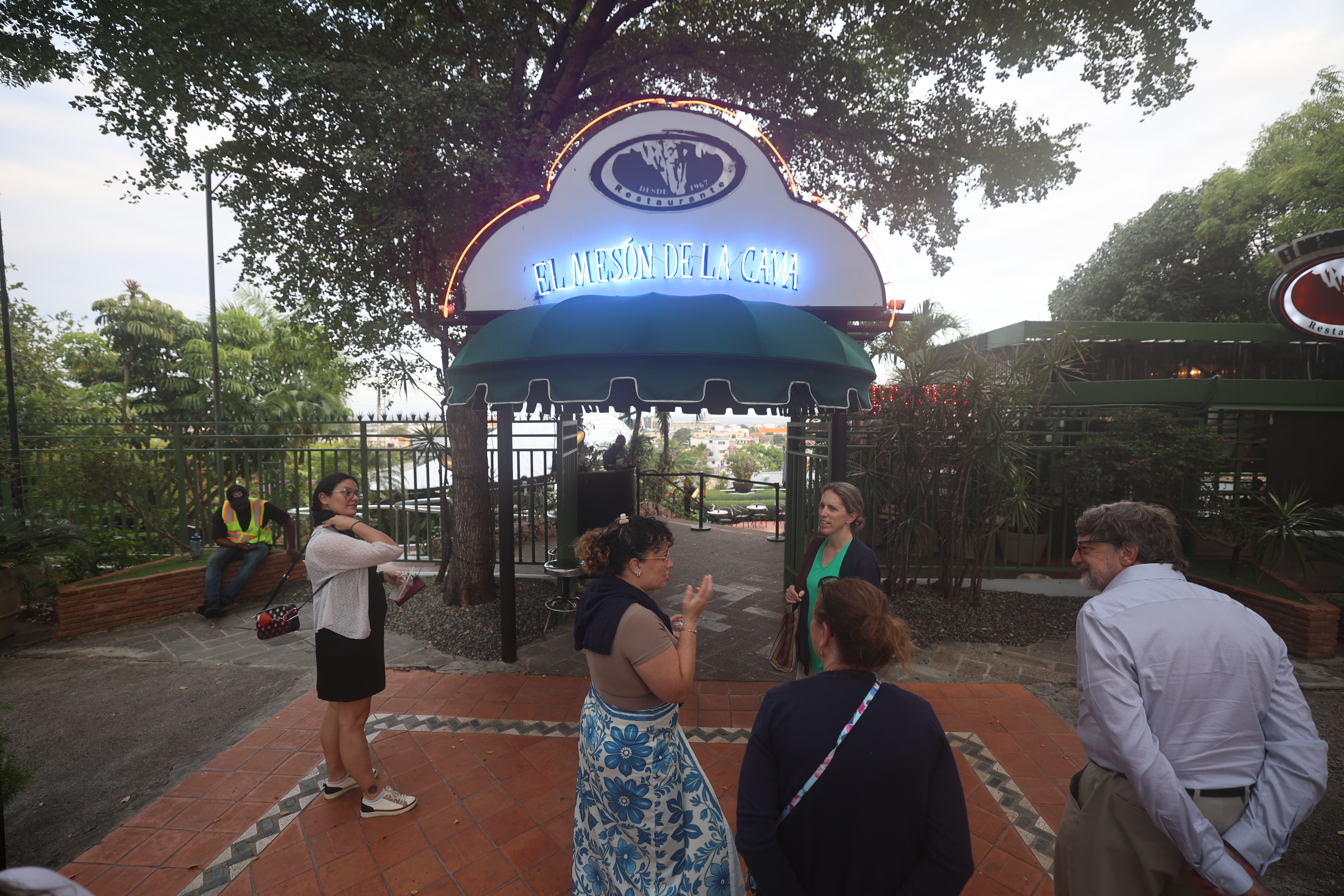 Entrance to the natural limestone cave restaurant with elegant signage