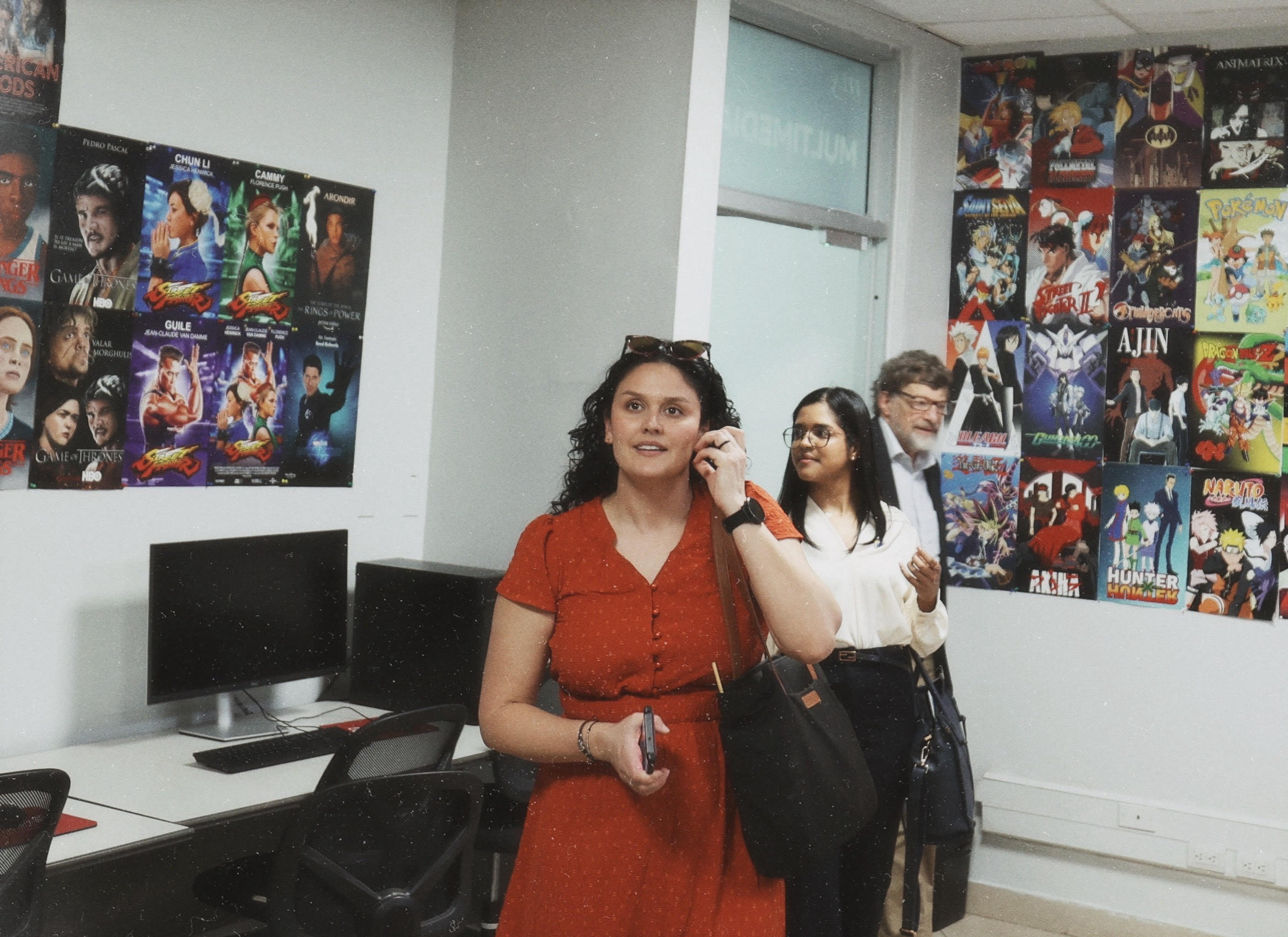 Amanda looking at student art in the digital art studio