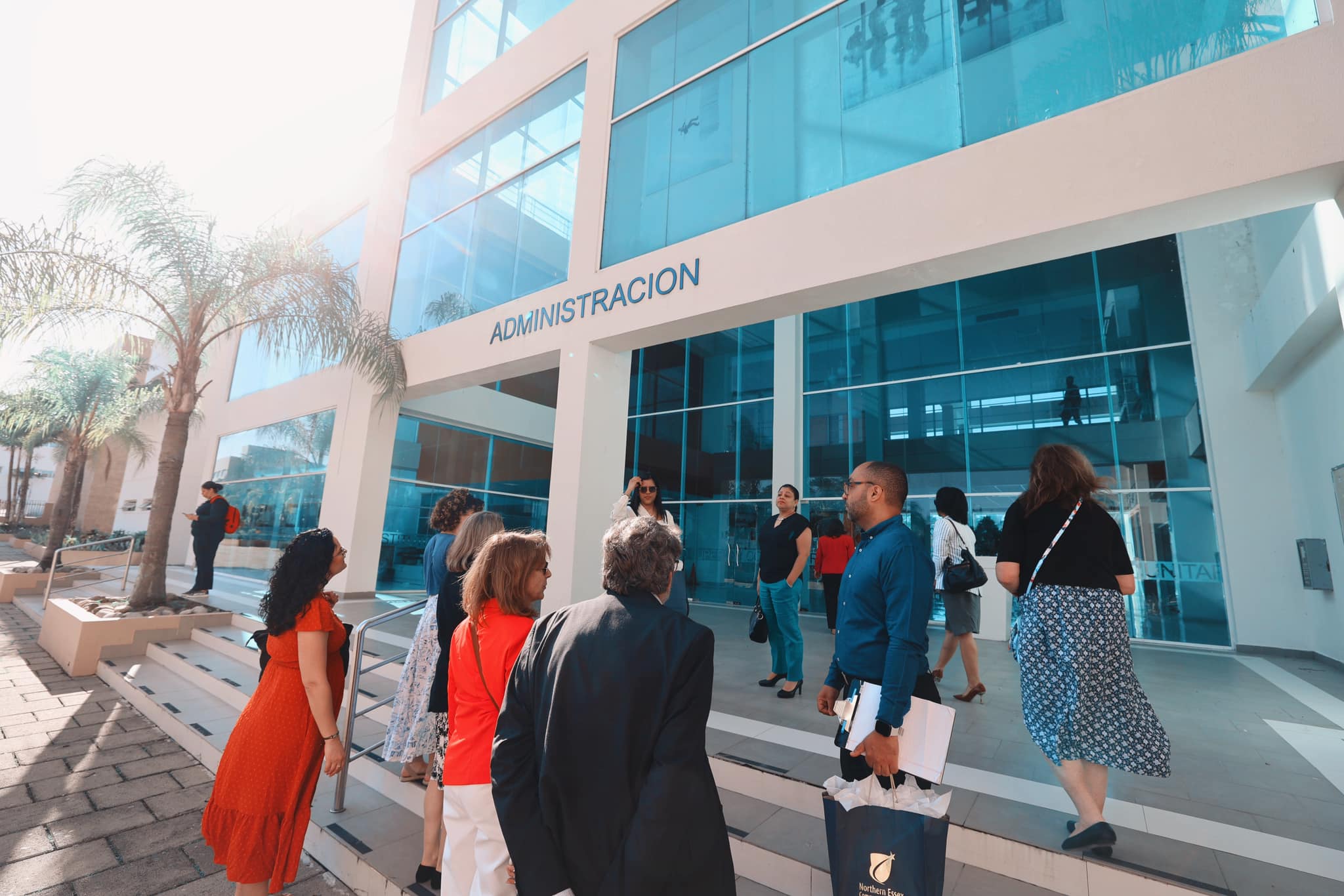 ITSC administration building entrance with group gathering outside