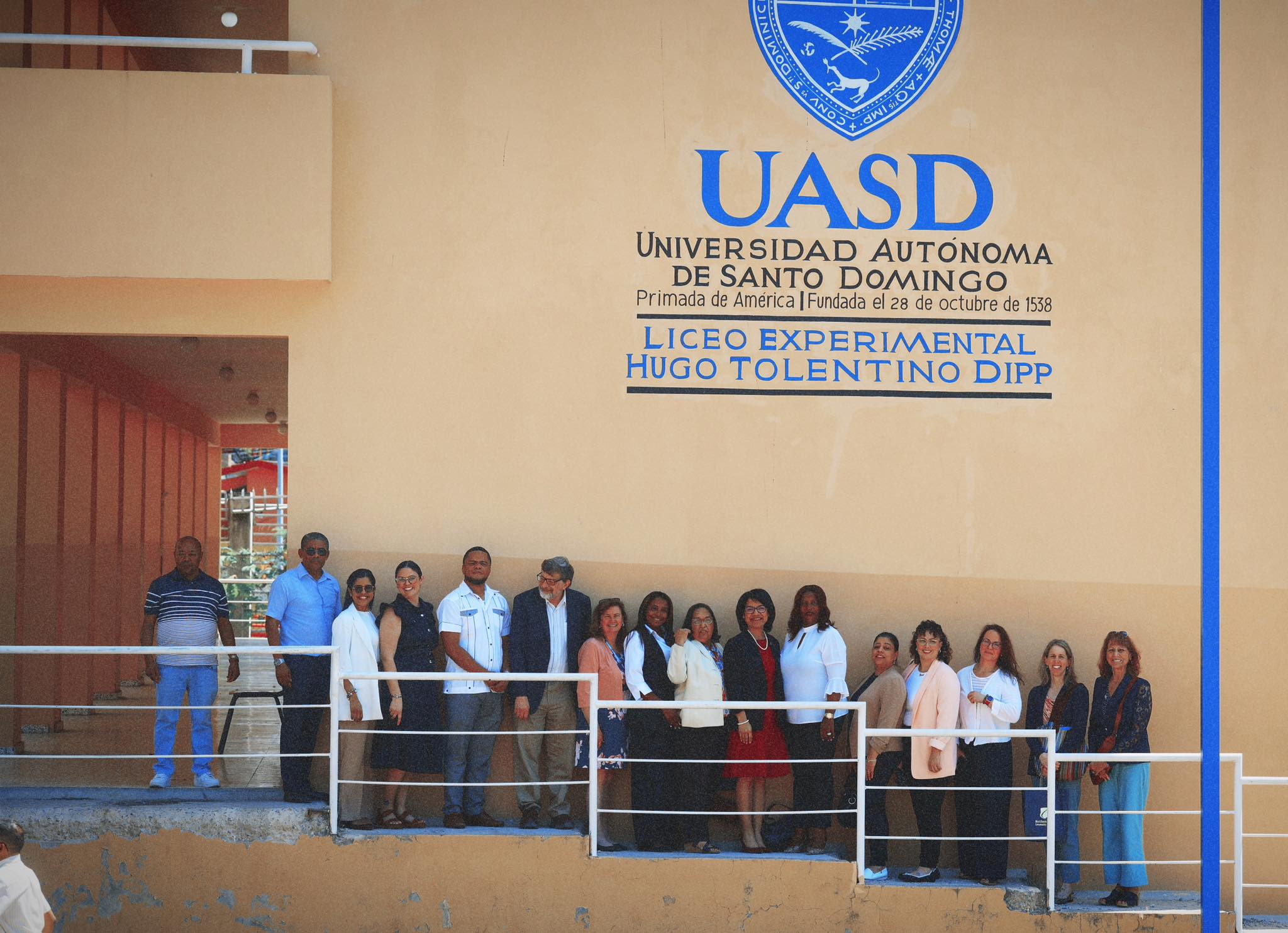 Our group photo in front of the school's official UASD sign indicating its founding date