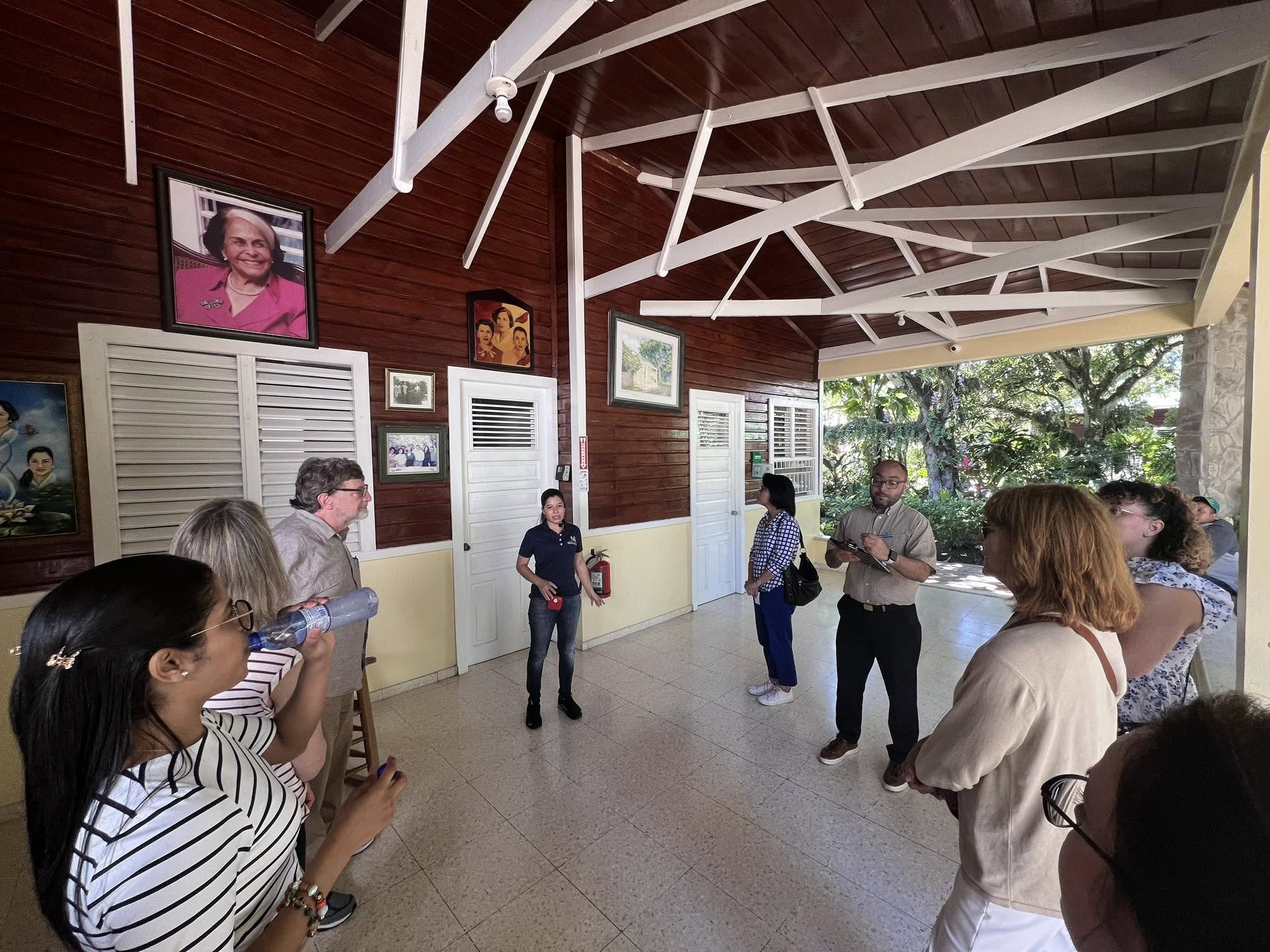 Interior of the museum with portraits of the Mirabal sisters on wooden walls