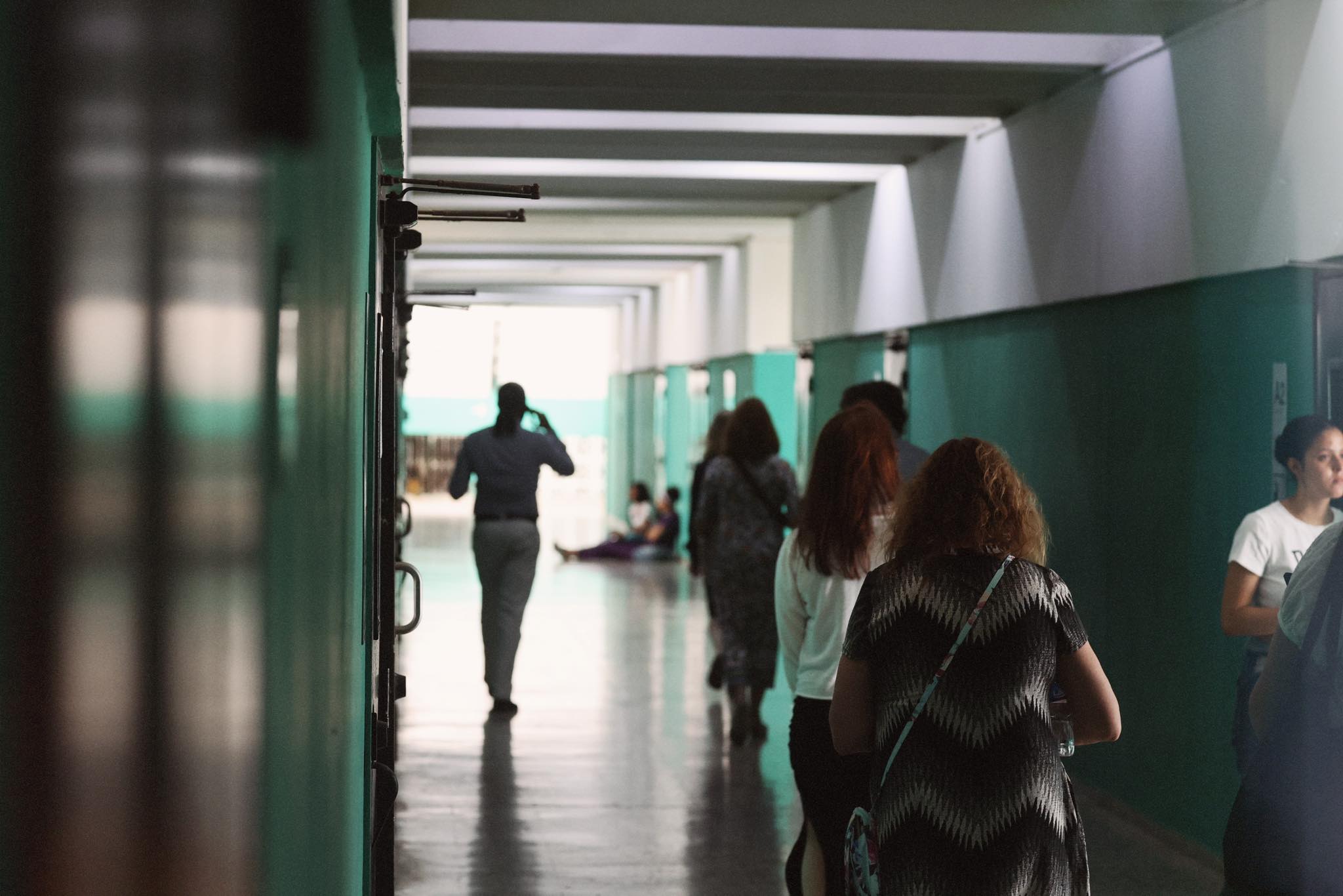 Walking through mint-green corridors of the medical school building